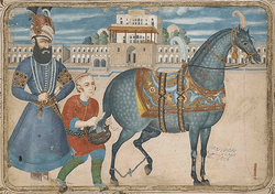 Karim_Khan_beside_a_son_and_his_horse-min.png